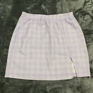Mini skirt size Small. Slit on the left thigh